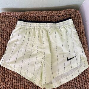 Nike Light Green Running Shorts with Black Trim and Swoosh